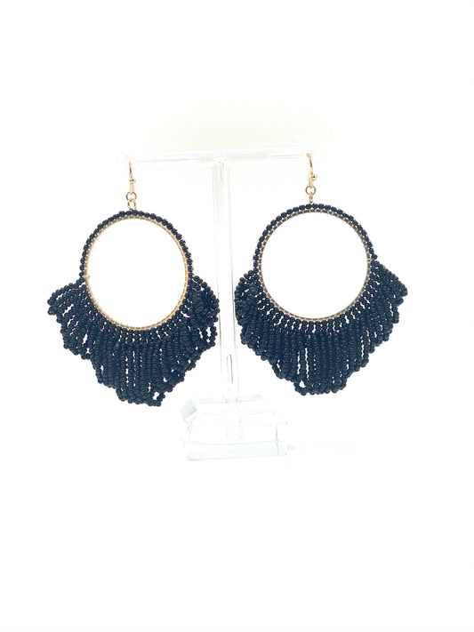 Add some fringe to your favorite outfit with these fun fringe beaded earrings! These earrings feature a gold hardware finish and a fish hook wire closure. Comes in Black or Teal.